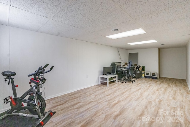 home office featuring light hardwood / wood-style flooring and a drop ceiling