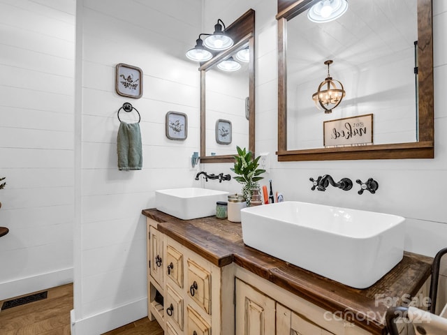 bathroom featuring vanity and wood-type flooring