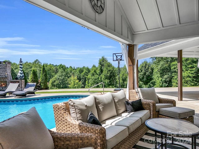 view of swimming pool featuring a patio and an outdoor hangout area