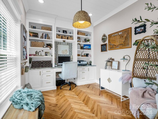 office space featuring built in desk and light parquet floors