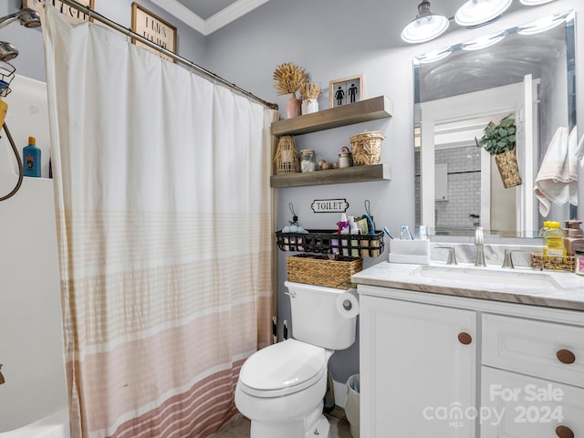 bathroom featuring crown molding, vanity, and toilet