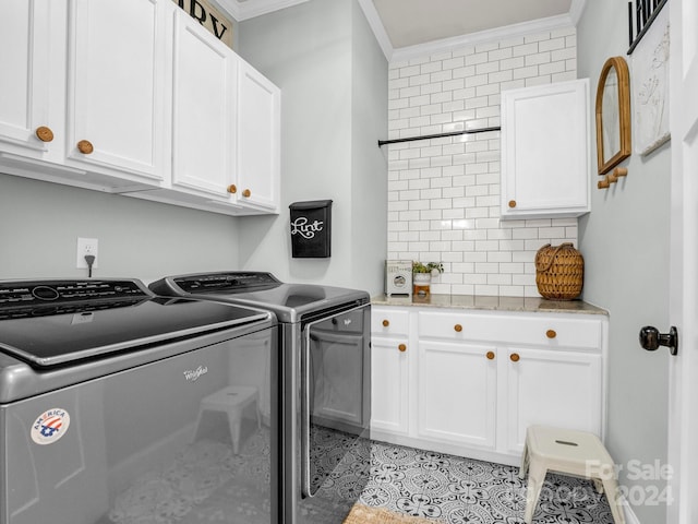 laundry area with cabinets, light tile patterned floors, washer and dryer, and crown molding