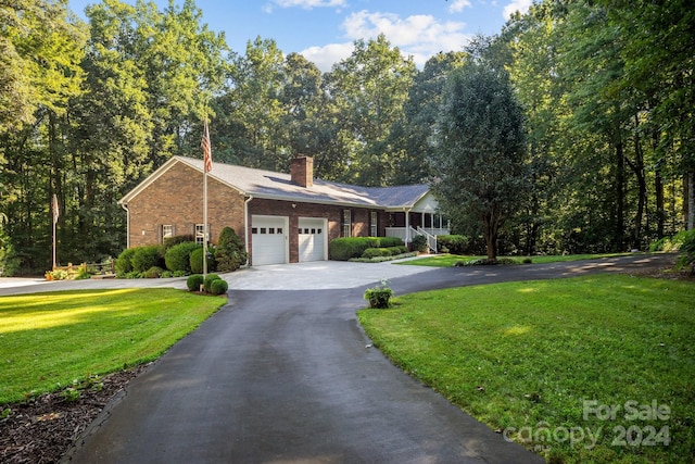 ranch-style home featuring a front yard