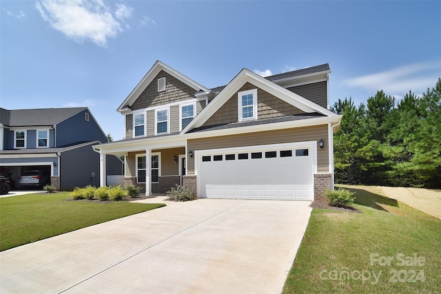 craftsman-style house with a front lawn and a garage