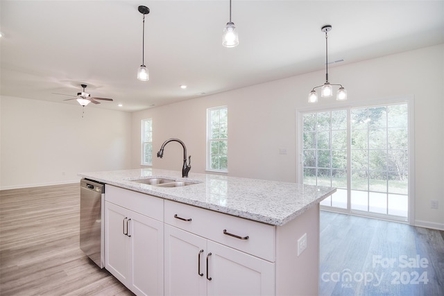 kitchen with sink, ceiling fan, light hardwood / wood-style floors, and stainless steel dishwasher