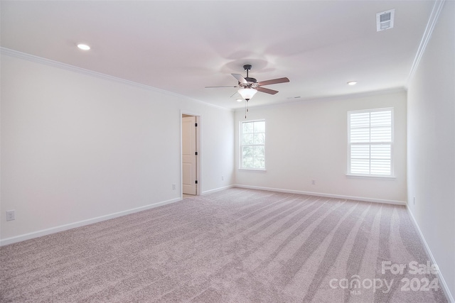 carpeted empty room featuring ceiling fan and ornamental molding