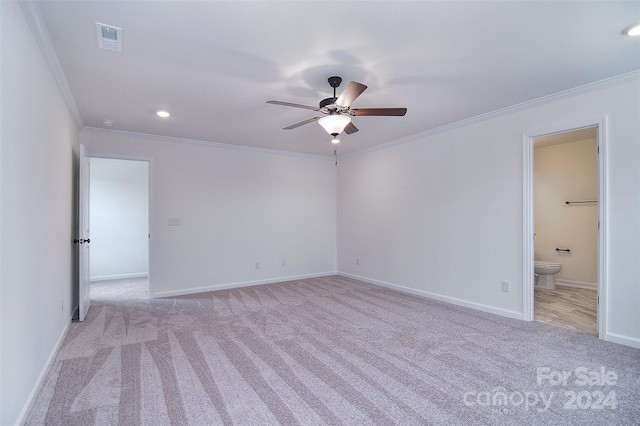 unfurnished room featuring ceiling fan, crown molding, and light colored carpet