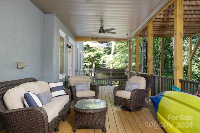 deck featuring an outdoor hangout area and ceiling fan