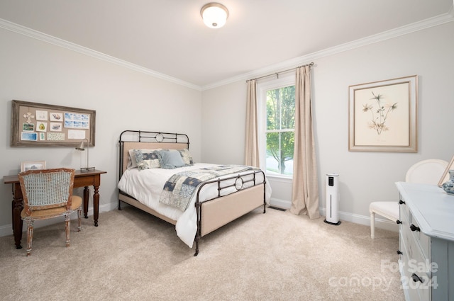 bedroom featuring crown molding, baseboards, and light carpet