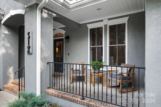 property entrance with covered porch