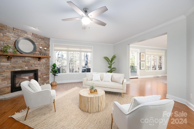 6 Larue Ct, Biltmore Lake, NC 28715 - living area featuring wood finished floors, healthy amount of natural light, a fireplace, and ornamental molding