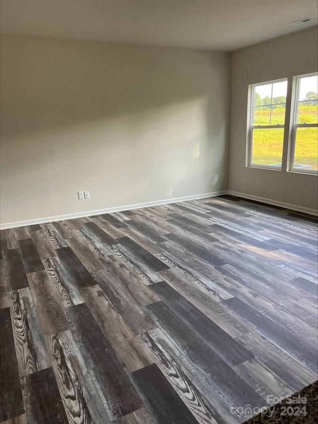 spare room with hardwood / wood-style floors