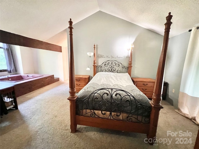 bedroom featuring lofted ceiling, carpet flooring, and a textured ceiling