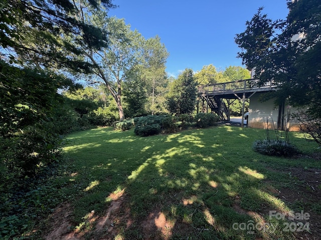 view of yard with a wooden deck