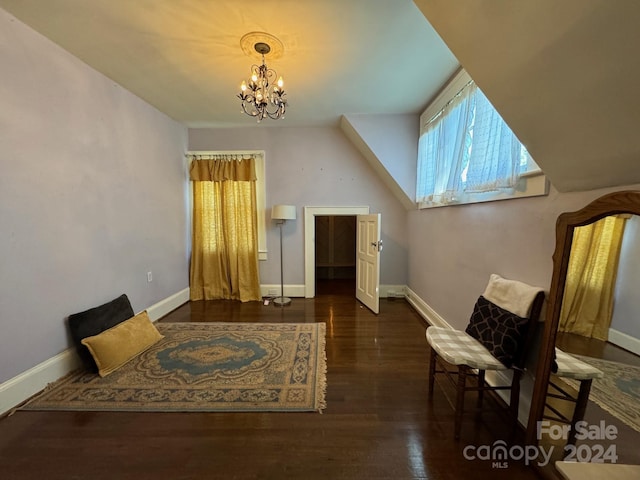 interior space featuring a notable chandelier and dark hardwood / wood-style floors