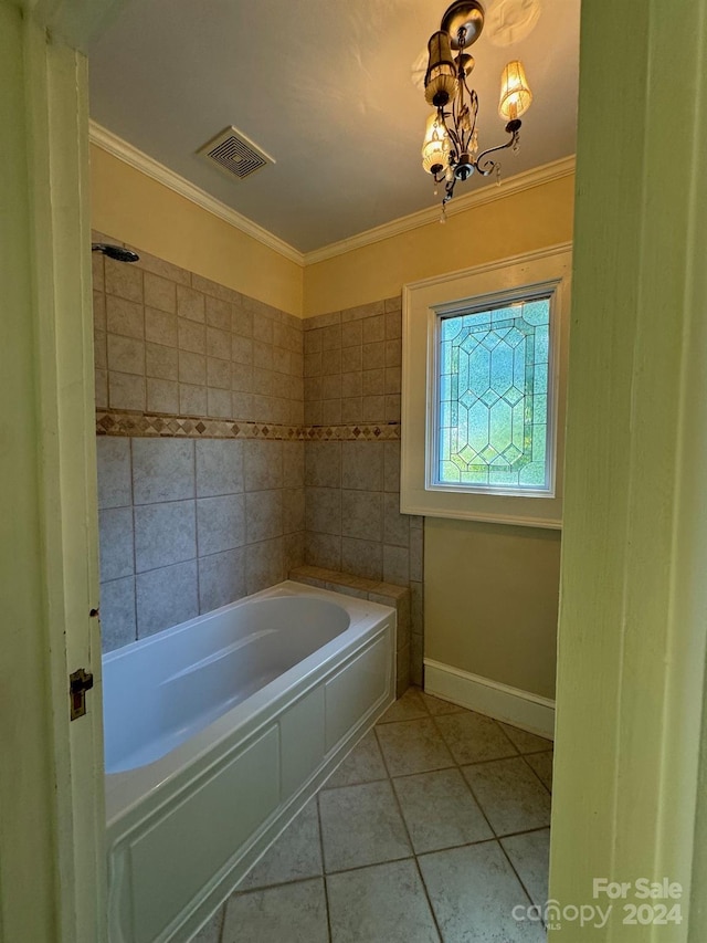 bathroom featuring ornamental molding, an inviting chandelier, tile patterned floors, and a washtub