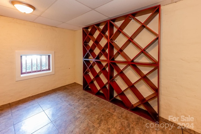 wine room featuring a drop ceiling