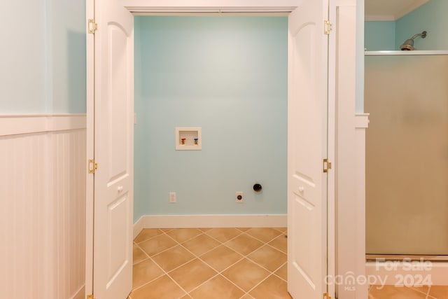 clothes washing area featuring hookup for a washing machine, light tile patterned floors, and electric dryer hookup