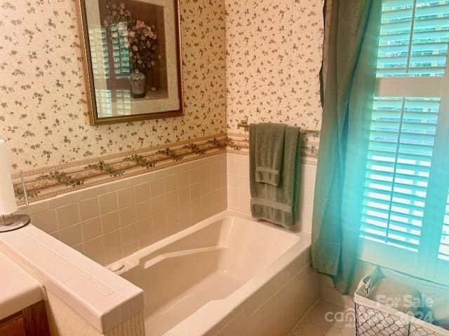 bathroom featuring a bathtub and vanity