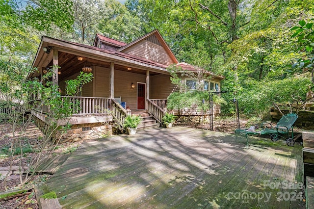 view of front facade with a porch and a deck