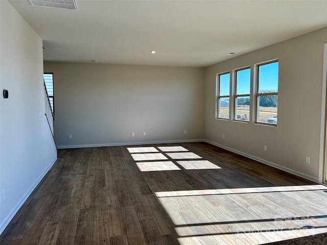 empty room featuring wood-type flooring