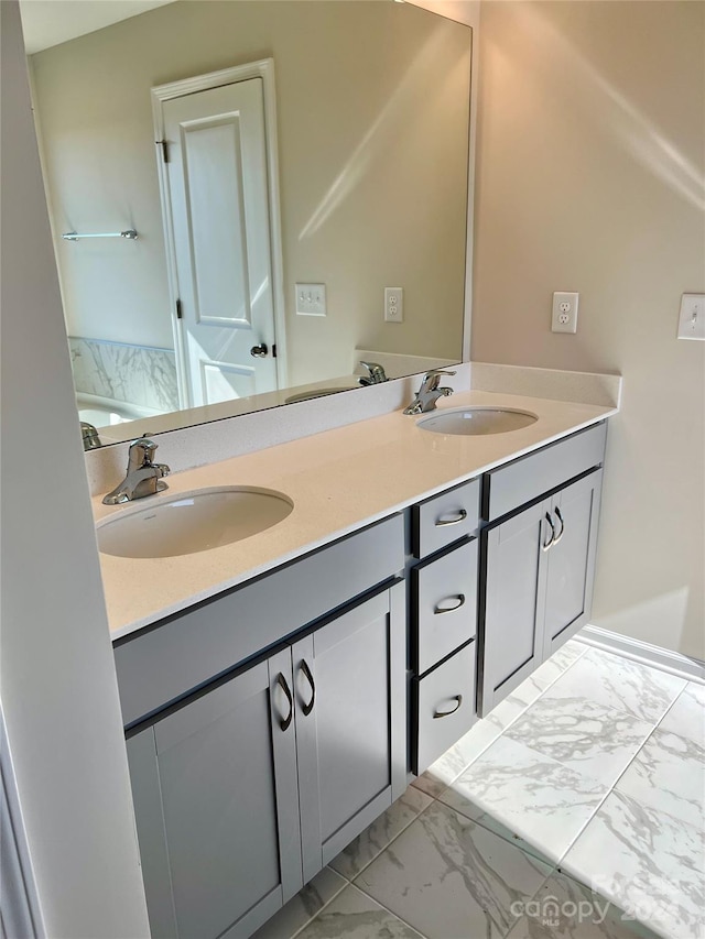 bathroom featuring tile patterned flooring and vanity