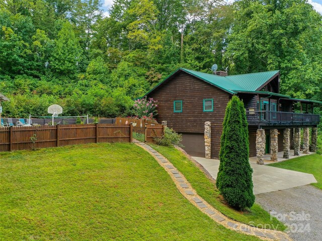 exterior space with a wooden deck and a garage