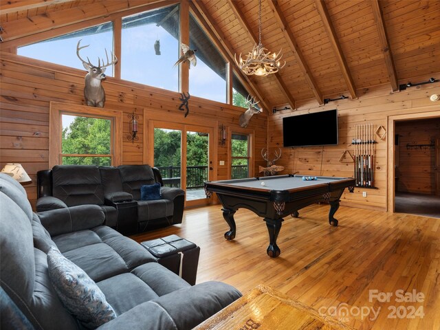 playroom with billiards, wood walls, beamed ceiling, and light hardwood / wood-style floors