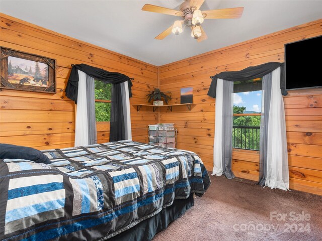 bedroom with multiple windows, carpet floors, and ceiling fan