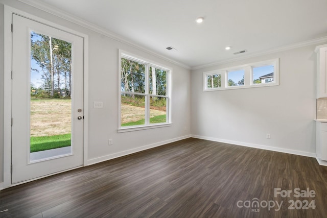 interior space featuring dark wood-style floors, visible vents, crown molding, and baseboards