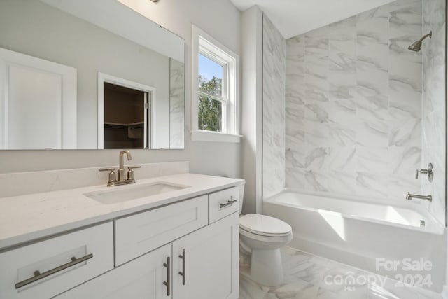 full bathroom featuring vanity, toilet, and tiled shower / bath combo