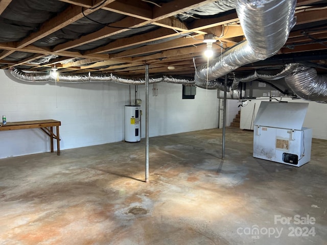 basement featuring heating unit and water heater