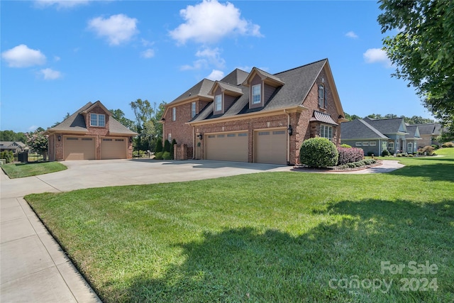 view of front of property with concrete driveway, brick siding, and a front lawn