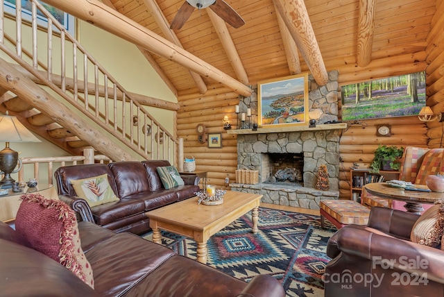 living room with log walls, a stone fireplace, high vaulted ceiling, and wooden ceiling