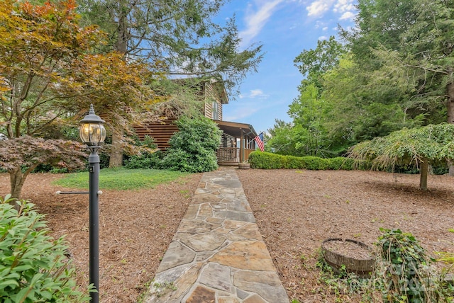 view of yard featuring covered porch