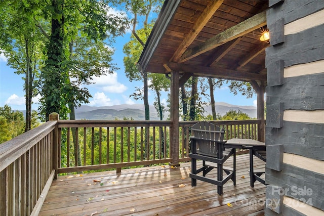 wooden deck with a mountain view