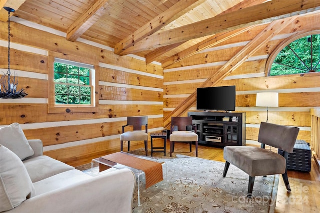 living room with wood ceiling, hardwood / wood-style flooring, and vaulted ceiling with beams