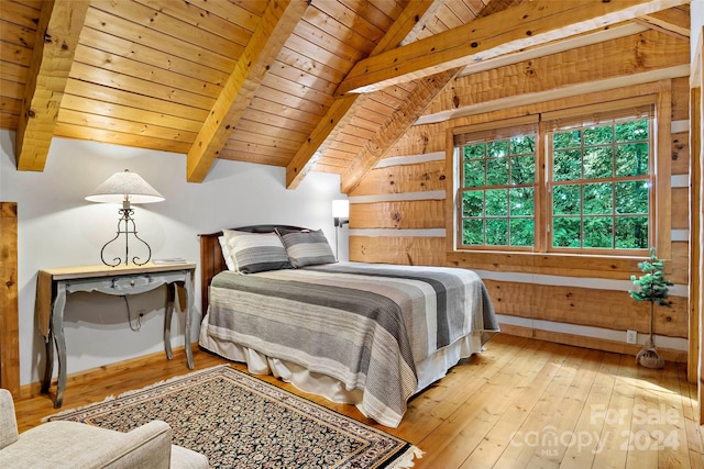 bedroom with wood ceiling, wood walls, lofted ceiling with beams, and light hardwood / wood-style floors