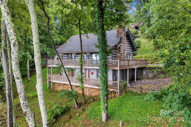 back of house featuring a deck