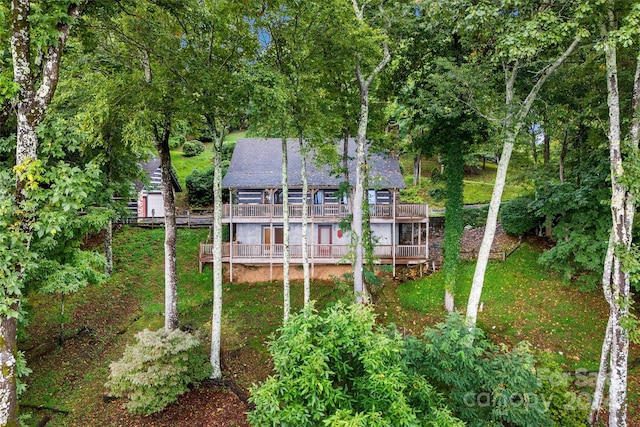 rear view of house featuring a deck