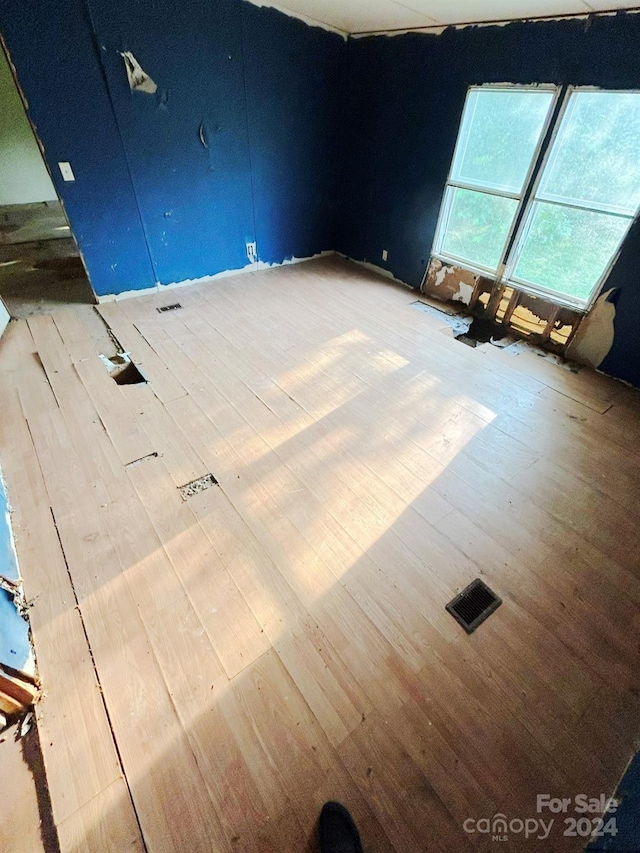 spare room featuring hardwood / wood-style floors