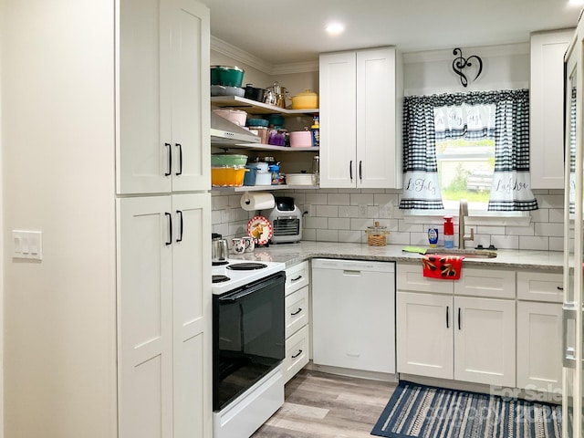 kitchen featuring white appliances, a sink, white cabinetry, ornamental molding, and open shelves