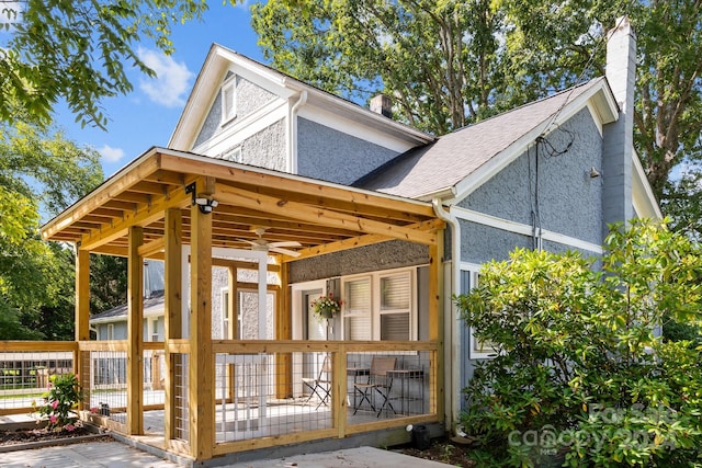 back of house featuring ceiling fan