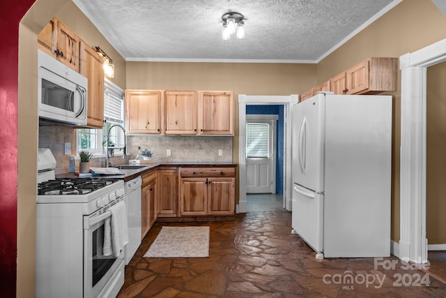 kitchen featuring light brown cabinets, decorative backsplash, sink, a textured ceiling, and white appliances