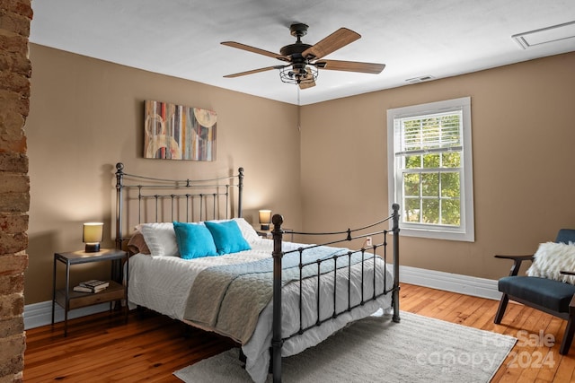 bedroom featuring ceiling fan and hardwood / wood-style flooring