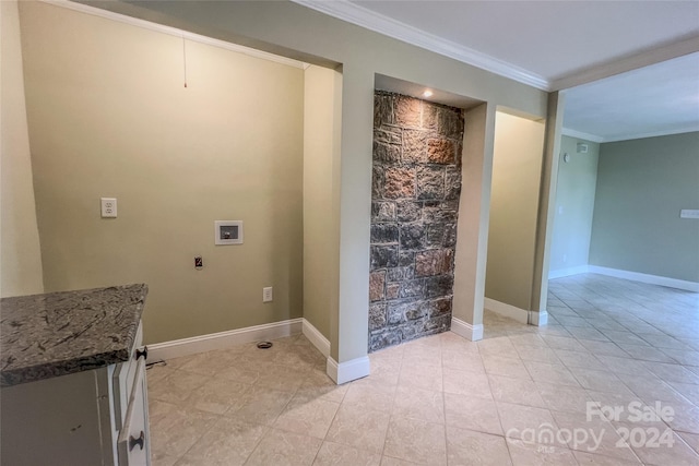 laundry area with hookup for a washing machine, crown molding, and light tile patterned flooring