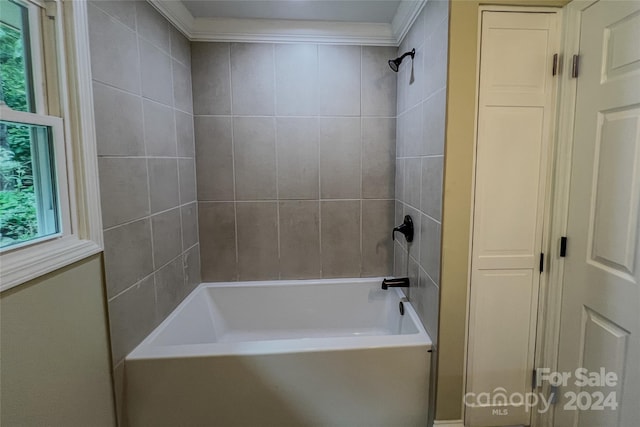 bathroom featuring bathtub / shower combination and crown molding