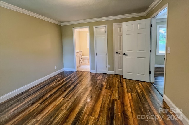 unfurnished bedroom with hardwood / wood-style floors, connected bathroom, and crown molding