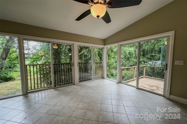 unfurnished sunroom featuring ceiling fan and vaulted ceiling