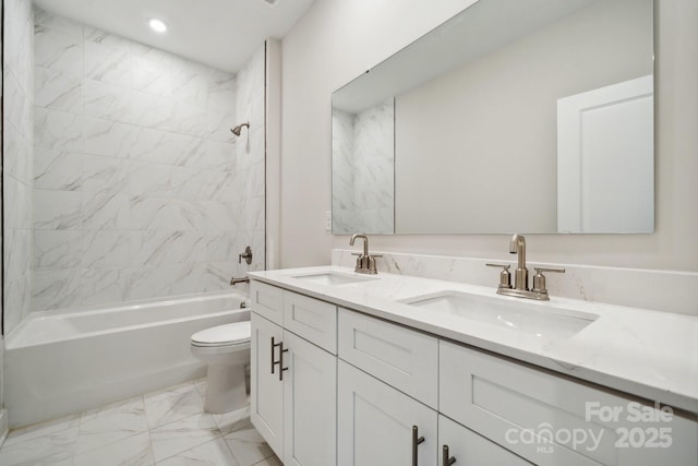 full bathroom featuring vanity, toilet, and tiled shower / bath combo